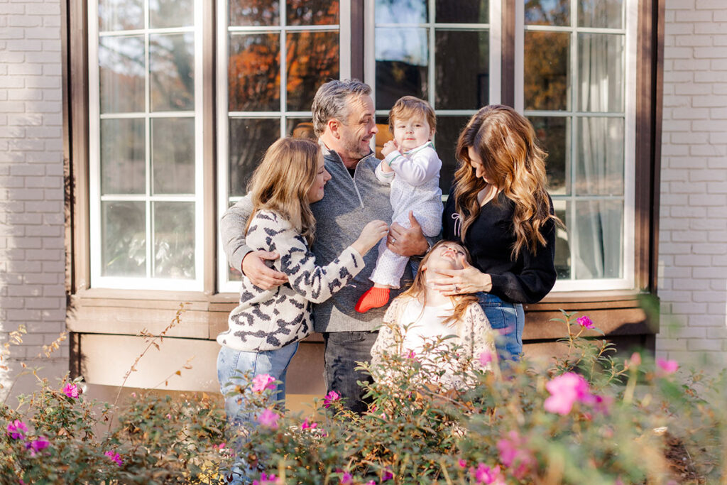 Playful family portrait featuring kids being silly together in Little Rock home