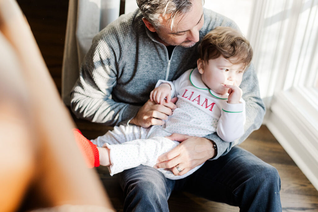 Dad holding baby while photographed in Little Rock Arkansas