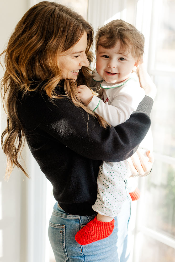 Mother and son sharing a laugh during an in-home family session in Little Rock