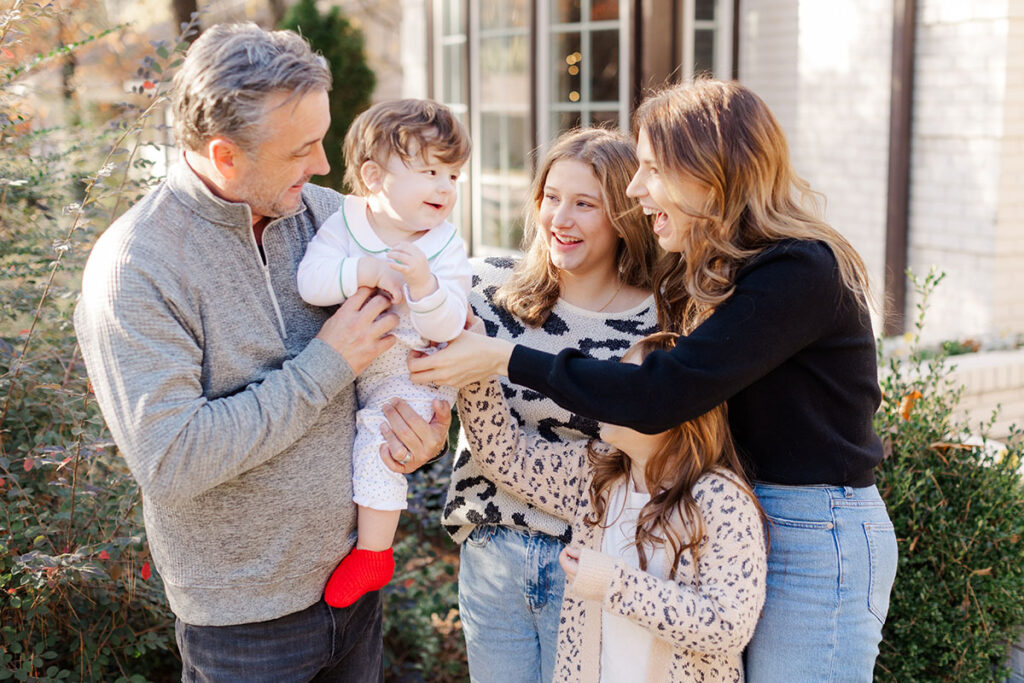 Playful family portrait featuring kids being silly together in Little Rock home