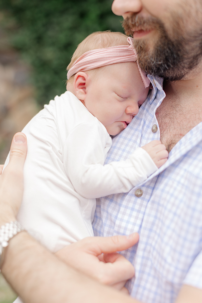 Little Rock newborn photography session capturing real-life moments at home