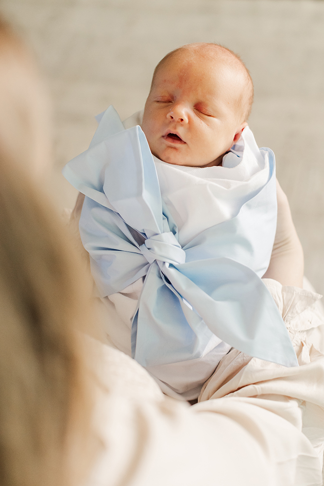Close-up of a sleeping newborn during intimate family session.
