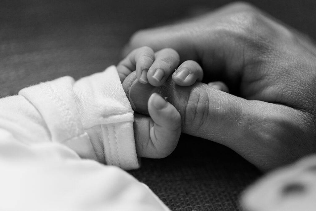 Natural light family photo with one-week-old newborn in Little Rock
