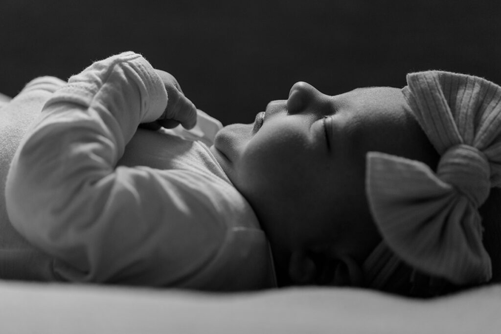 black and white portrait of newborn baby sleeping