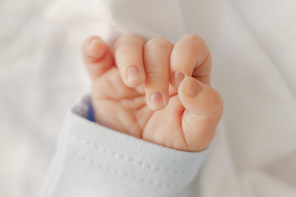 Close-up of newborn’s tiny hand 
