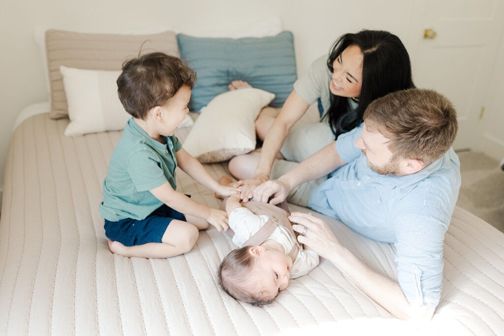 Brothers playing with their parents during their playful family photography session